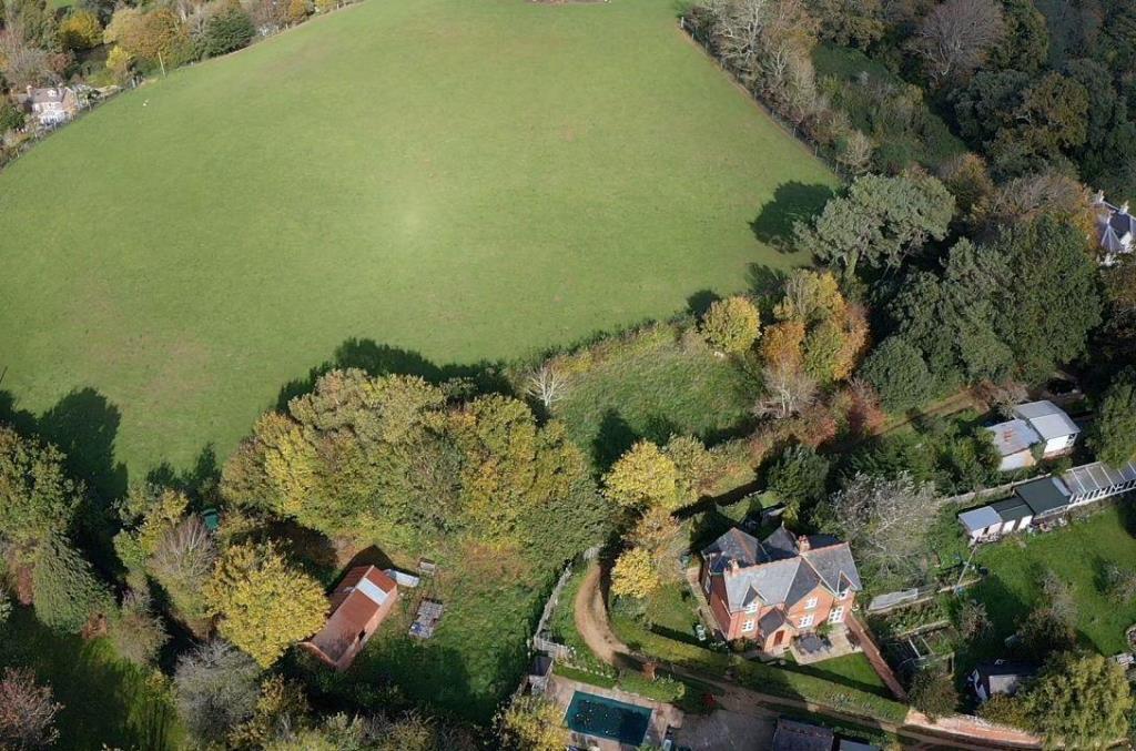 Lot: 30 - HALF AN ACRE AND A BARN WITH POTENTIAL IN AN ATTRACTIVE SEMI RURAL LOCATION - A View of the Site From Above